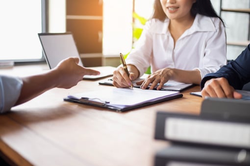 Close up of business people working together in office. Business concept.