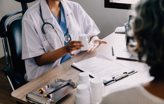Doctor giving a patient medication