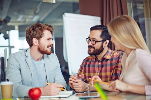 Three colleagues interacting about new strategies