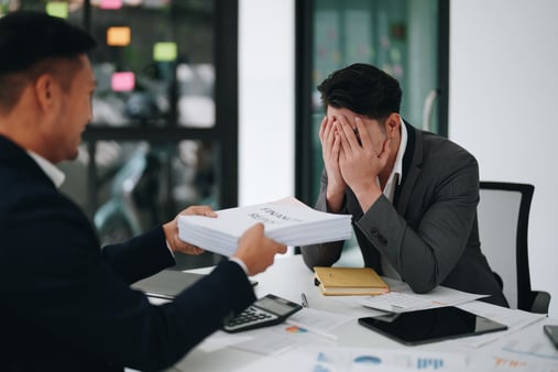 Concept of panicking. An employee panicking at the thought of working on forms. 