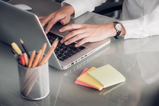 Someone at a computer processing a MLR