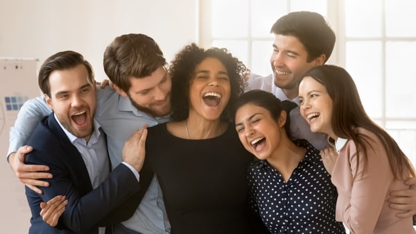 A group of people talking and laughing