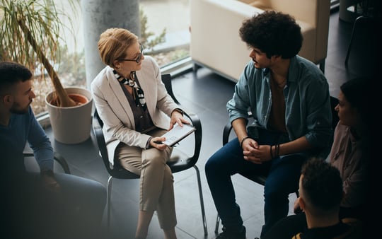Concept of mental health and help with addiction. A counseling session with employees. 