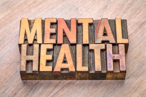 Image with the words Mental Health engraved in wood 