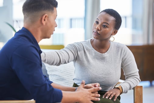 An employee supporting another employee in their grief. 