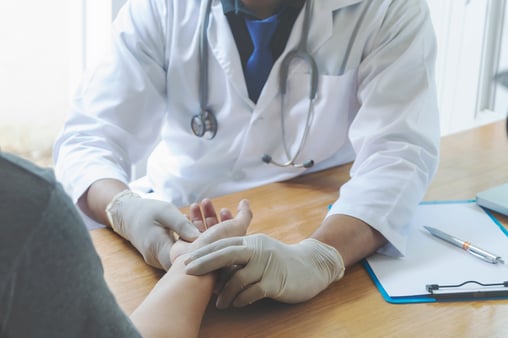 A healthcare provider and a patient getting preventive care