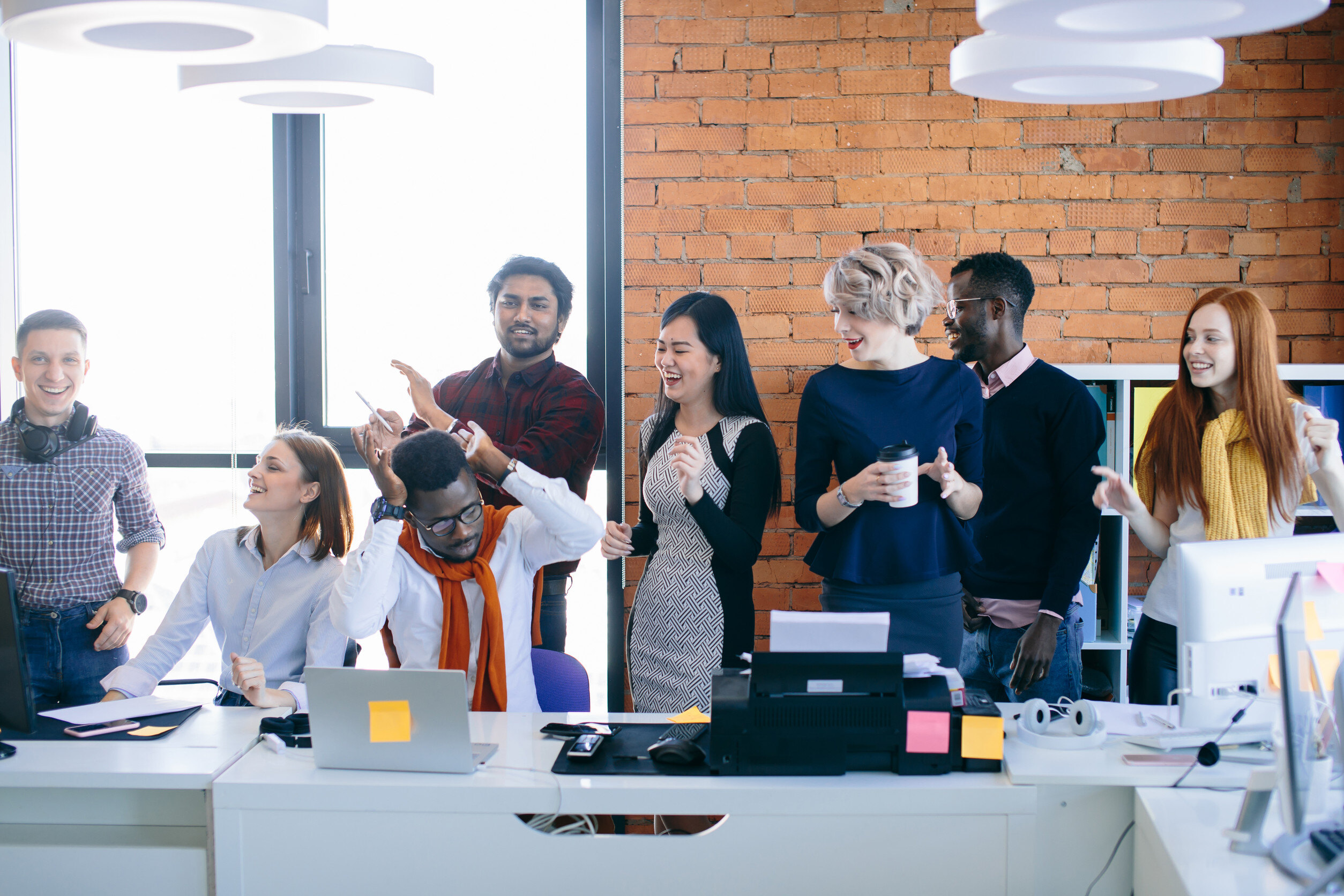 A productive and happy team discussing benefits