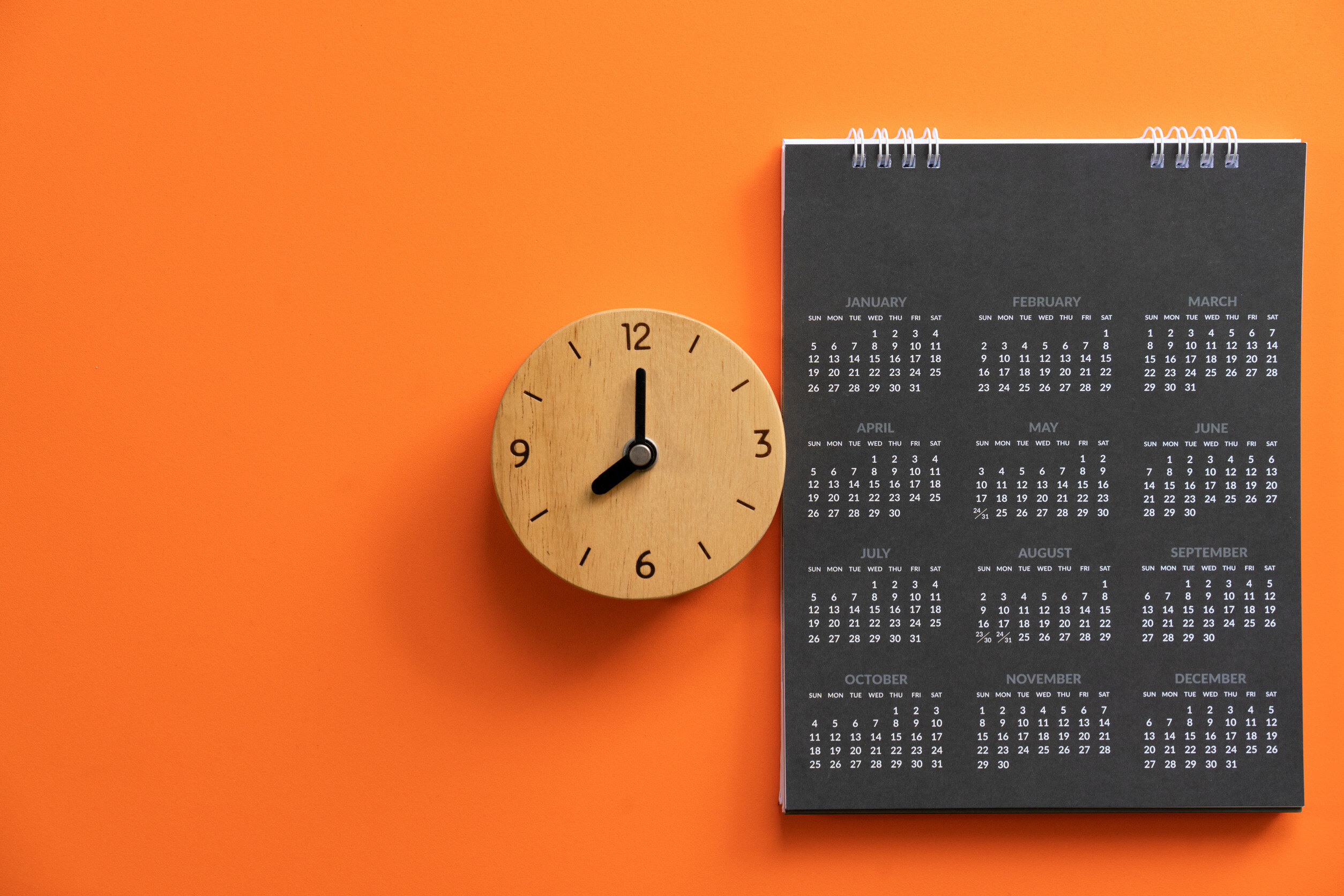 The concept of deadline. A clock and a 2025 calendar. 