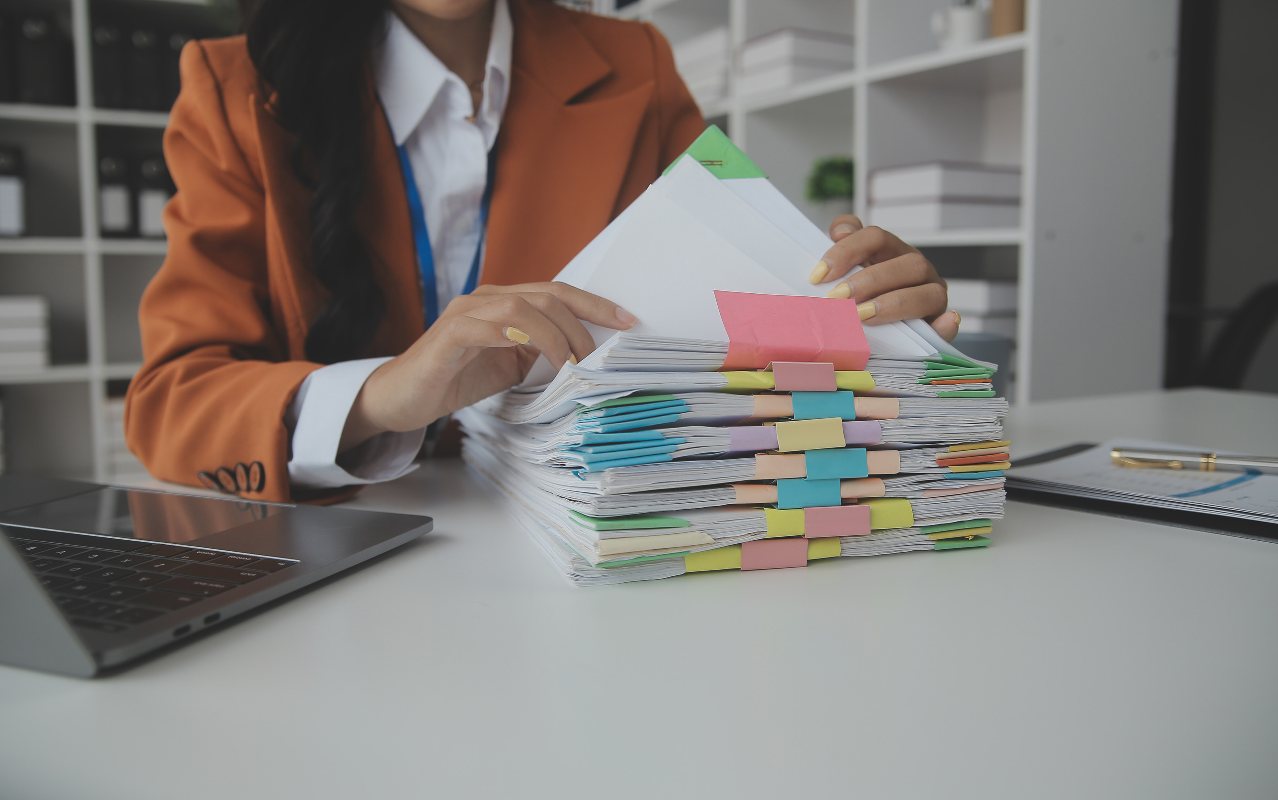 Person looking through plan documents 