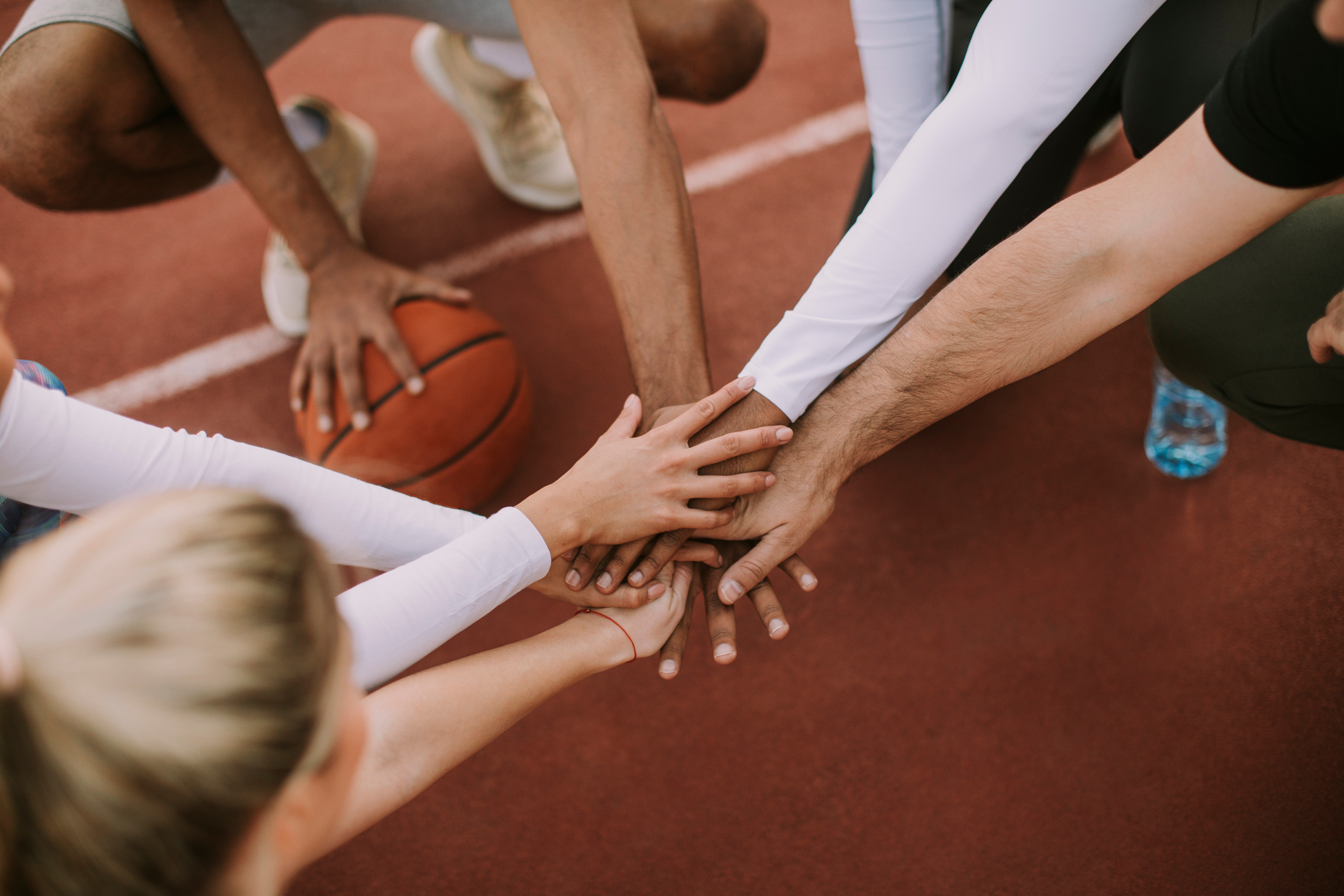 The concept of a team sport. A team playing basketball. 